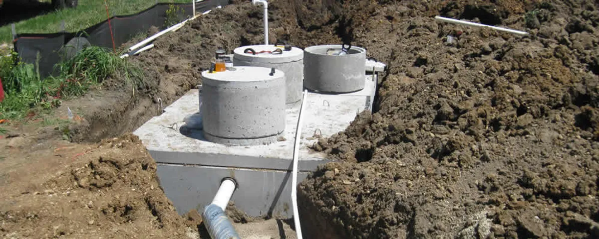 Septic system repair and installation site with tank access ports in Portland, OR