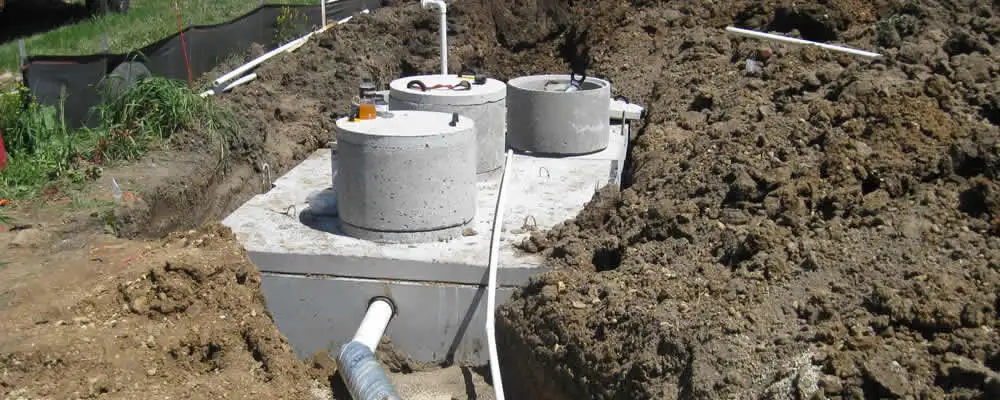 Septic system repair and installation site with tank access ports in Portland, OR